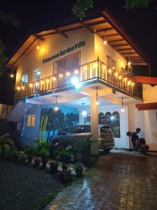 a car parked in front of a building at night at Cinnamon garden villa in Weligama