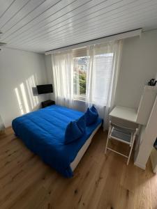 Postel nebo postele na pokoji v ubytování Gästehaus MaryVitty, zentrale zwischen Aarau und Olten, gut verbunden