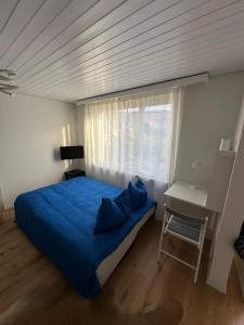 Postel nebo postele na pokoji v ubytování Gästehaus MaryVitty, zentrale zwischen Aarau und Olten, gut verbunden