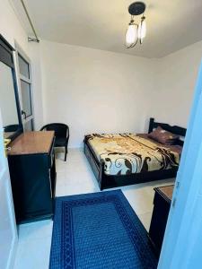 Postel nebo postele na pokoji v ubytování Madinaty Original