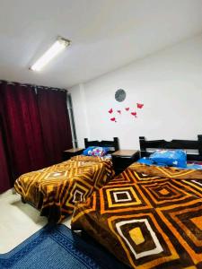 Postel nebo postele na pokoji v ubytování Madinaty Original