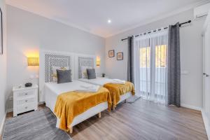 Ένα ή περισσότερα κρεβάτια σε δωμάτιο στο Quinta Ribeira do Arade
