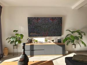 a living room with a table with potted plants at Apartment Bunja No2 in Drage