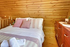 Postel nebo postele na pokoji v ubytování Double Paradise