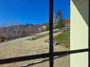a view from a window of a park at Gnezdo Studio Apart in Shipka