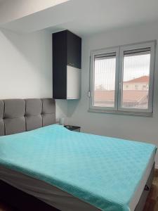 Postel nebo postele na pokoji v ubytování SL Property Skopje