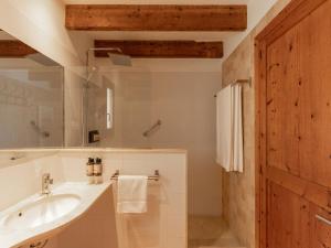 a bathroom with a sink and a mirror at Es Petit de Valldemossa in Valldemossa