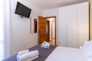 Postel nebo postele na pokoji v ubytování LE CASETTE DI FLAVIA - Trinacria, Oasi Marina, il Tesoro dell'Etna