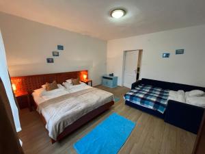Posteľ alebo postele v izbe v ubytovaní Francesco Apartmanház