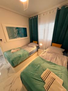 Posteľ alebo postele v izbe v ubytovaní Apartament Vinamar VI La Mata