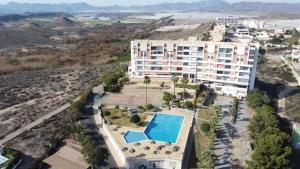 an aerial view of a large building with a swimming pool at CALARREONA - Apartamento a 100 metros de la playa in Águilas
