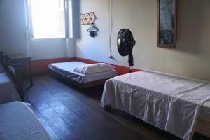 Llit o llits en una habitació de Cenário Hostel e Boteco