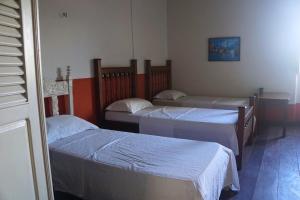 Llit o llits en una habitació de Cenário Hostel e Boteco