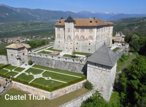 an aerial view of a castle in the mountains at Agritur Casa al Mulino Camere in Sanzeno +19 photos