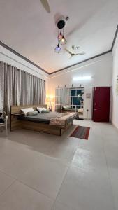 a bedroom with a large bed in a room at Ridhi inn in Jorhāt