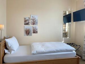 Postel nebo postele na pokoji v ubytování Hotel-Pension Hommen