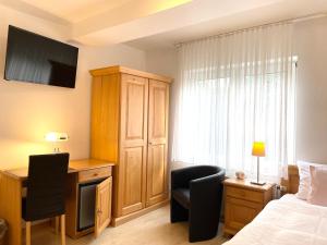 Postel nebo postele na pokoji v ubytování Hotel-Pension Hommen