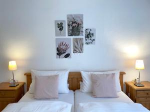 Postel nebo postele na pokoji v ubytování Hotel-Pension Hommen