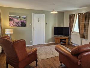 Et tv og/eller underholdning på Underhill Holiday Cottage