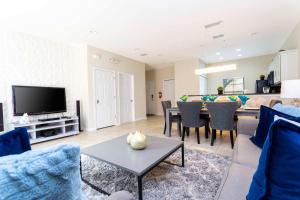 a living room with a couch and a table at Three Bedrooms Townhome 3012 in Kissimmee +61 photos