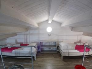 a large room with two beds and a couch at Campeggio Praia Mare in Campofelice di Roccella +101 photos