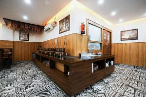 a bathroom with a counter with a sink in it at Hotel The 7 Seas in Rishīkesh