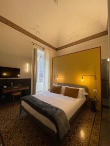 Letto o letti in una camera di B&B Cinquequinte