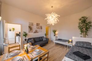 a living room with a couch and a table at Flower Love in Eilenburg
