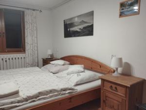 Posteľ alebo postele v izbe v ubytovaní Pod limbą