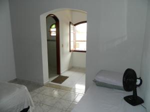 Cama ou camas em um quarto em Pousada Central de Cabreuva
