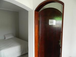 Cama ou camas em um quarto em Pousada Central de Cabreuva