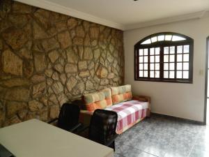 Cama ou camas em um quarto em Pousada Central de Cabreuva
