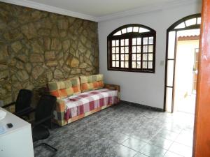 Cama ou camas em um quarto em Pousada Central de Cabreuva