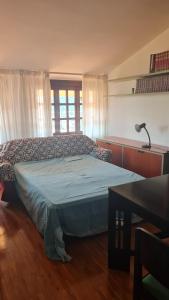 Postel nebo postele na pokoji v ubytování Sentirsi a casa