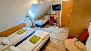 Postel nebo postele na pokoji v ubytování Hotel am Rathaus