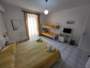 Letto o letti in una camera di Al Dammuso Diffuso in Centro