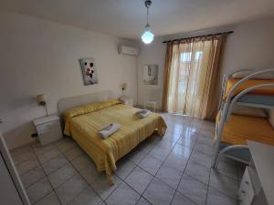 Letto o letti in una camera di Al Dammuso Diffuso in Centro