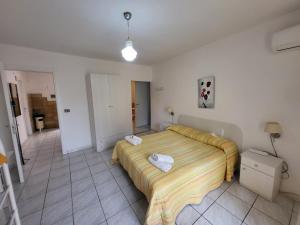 Letto o letti in una camera di Al Dammuso Diffuso in Centro