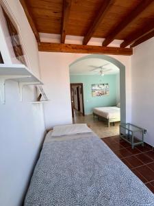 Posteľ alebo postele v izbe v ubytovaní Villa VISTALEGRE relax con increíbles vistas