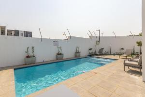 a swimming pool on top of a building at Binbin Serenity Suite in Midrand