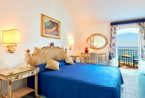 Postel nebo postele na pokoji v ubytování Hotel Villa Sirio