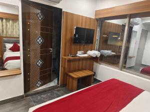 Postel nebo postele na pokoji v ubytování Hotel Maruti R