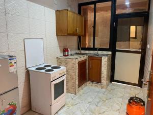 Køkken eller tekøkken på DAVAROXE Appartements Lingwala RTNC