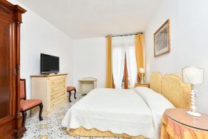 TV a/nebo společenská místnost v ubytování Hotel Villa Sirio
