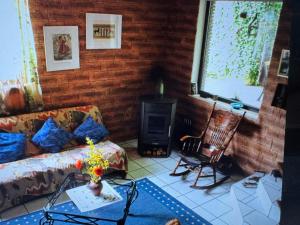 a living room with a couch and a stove at Ferienwohnung Danielle Kessler in Idar-Oberstein