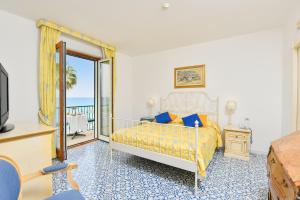 Postel nebo postele na pokoji v ubytování Hotel Villa Sirio