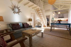 a living room with a couch and a table at Villa Domingues in Lisbon