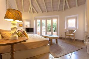 a bedroom with a bed and a lamp on a table at Villa Domingues in Lisbon