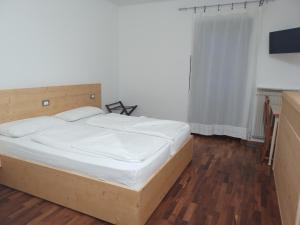 Postel nebo postele na pokoji v ubytování Oberthaler Hotel