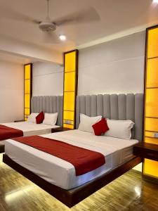 Postel nebo postele na pokoji v ubytování Sundaras Family Suites + 18 fotografií